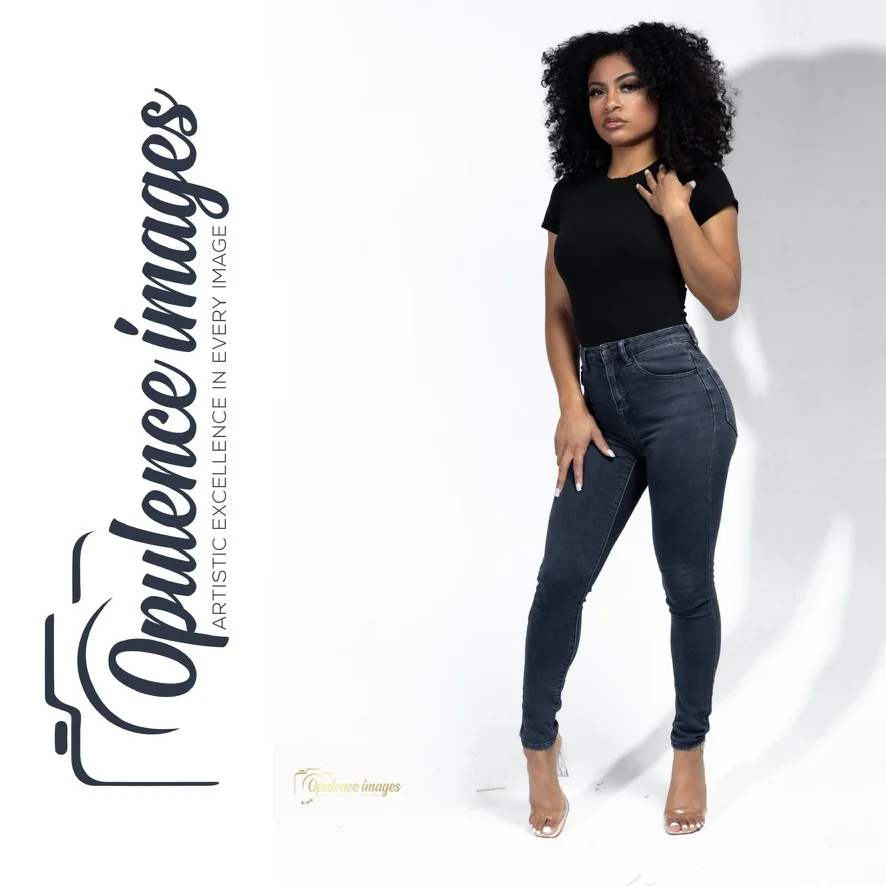 Full-length studio portrait in jeans, with Opulence Images branding