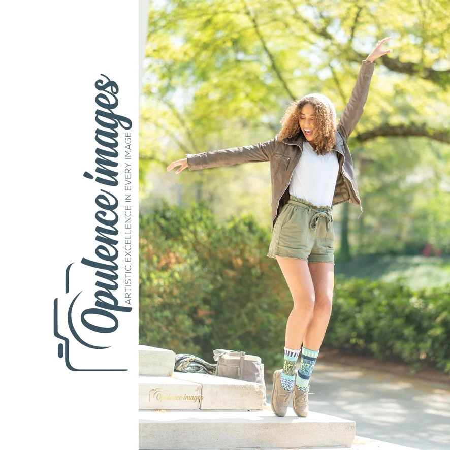 Playful outdoor portrait featuring patterned socks and Opulence Images branding